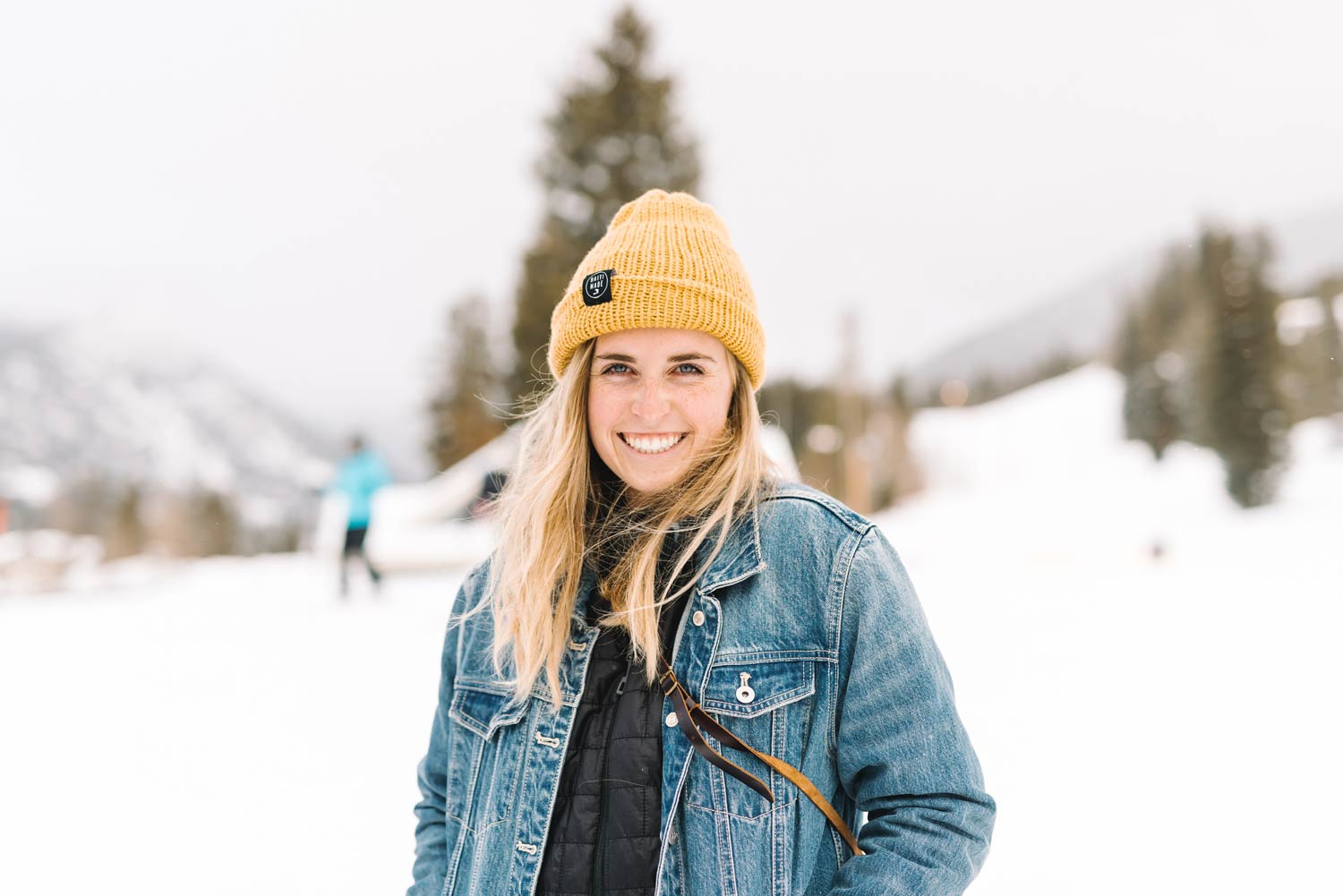 Samantha Ponder smiling with a yellow knit hat and blue jean jacket on.