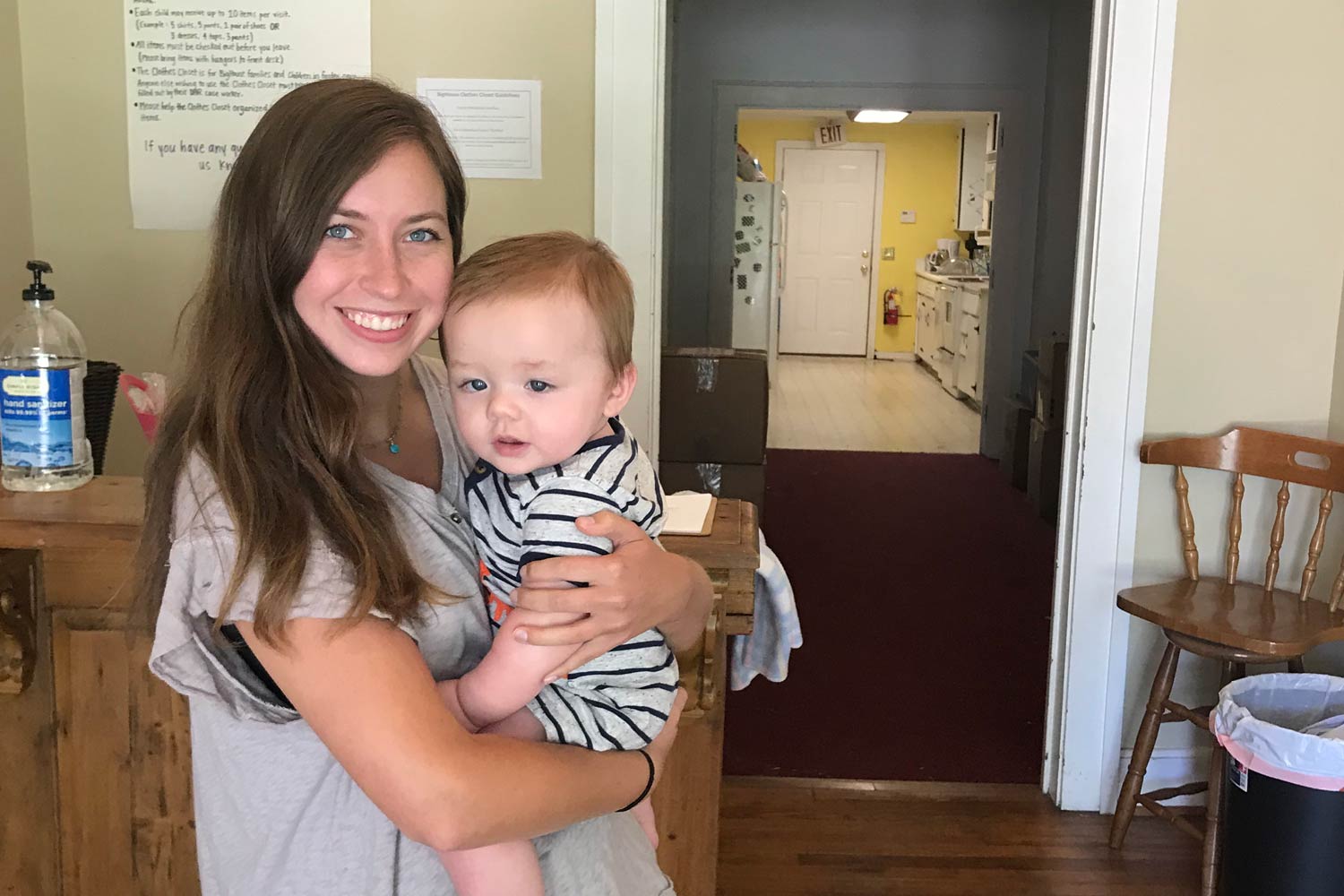 Sarah holding a baby at BigHouse.