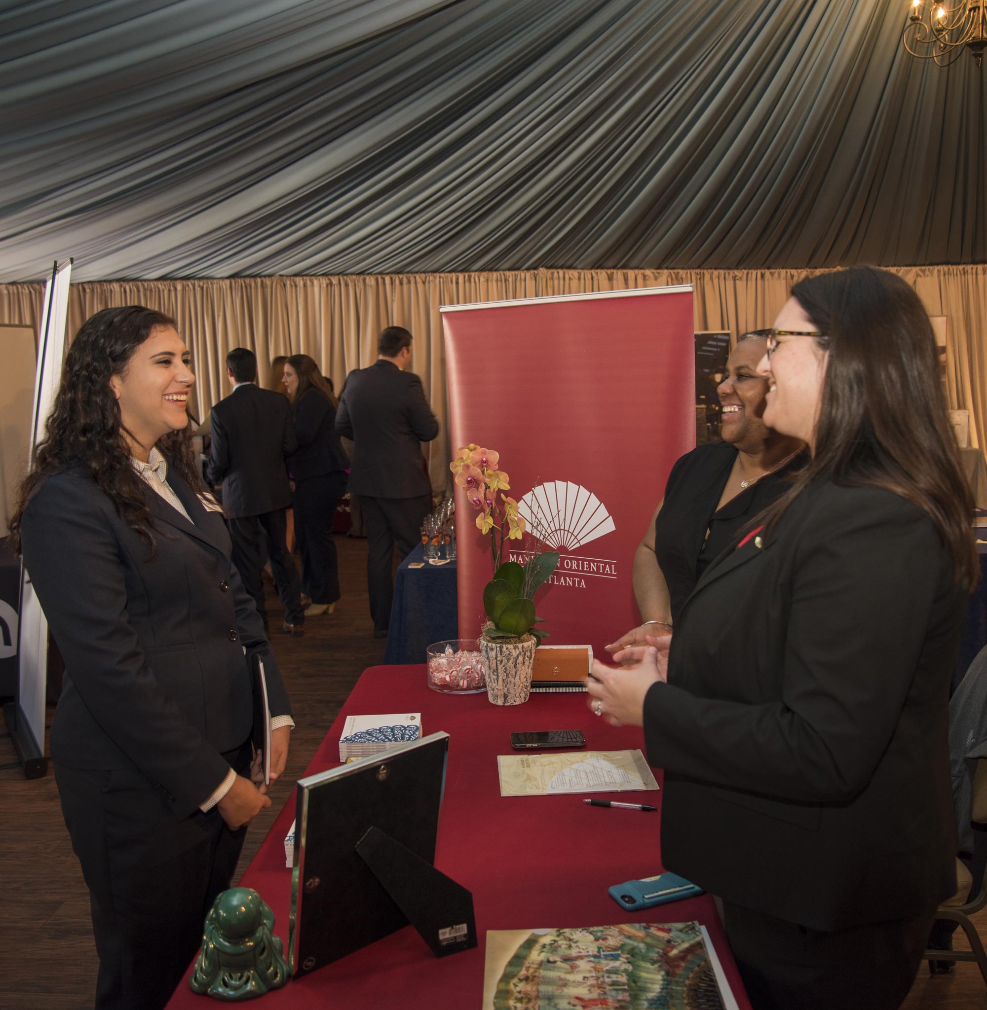 Hospitality student at the visiting a booth at the Career Fair.
