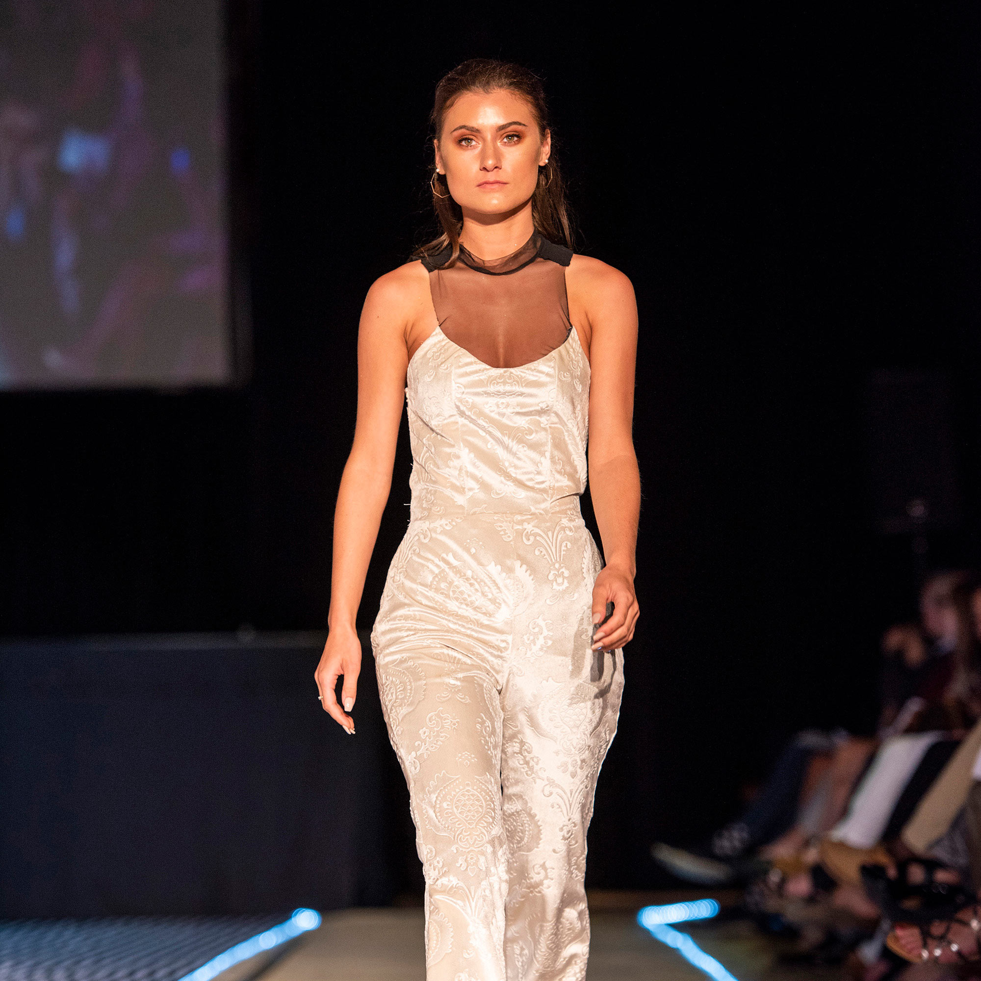 Model walking the runway in a cream colored jumper during The Fashion Event: Mod.
