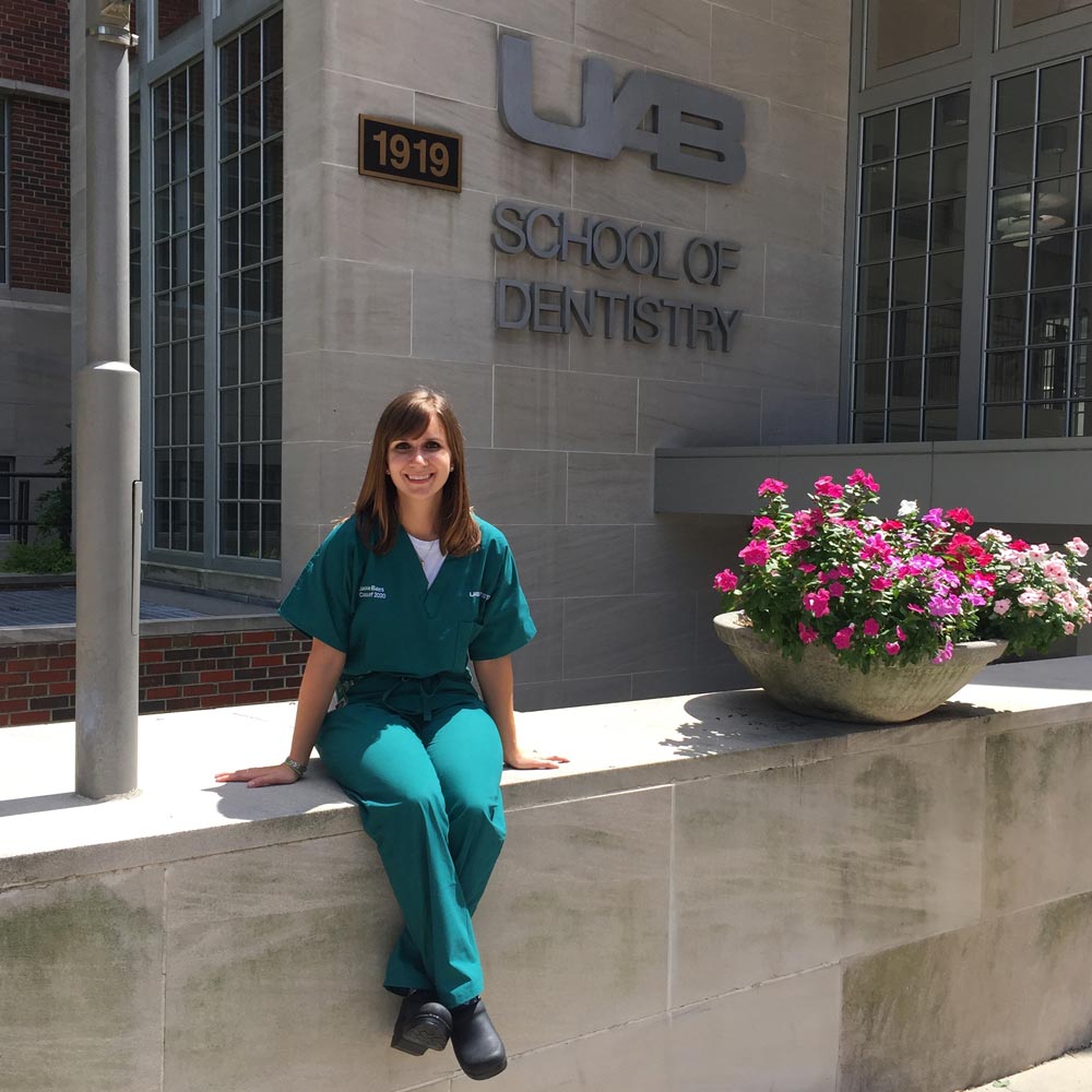 Auburn College of Human Sciences graduate Jackie Bates in front of the UAB School of Denistry Building.