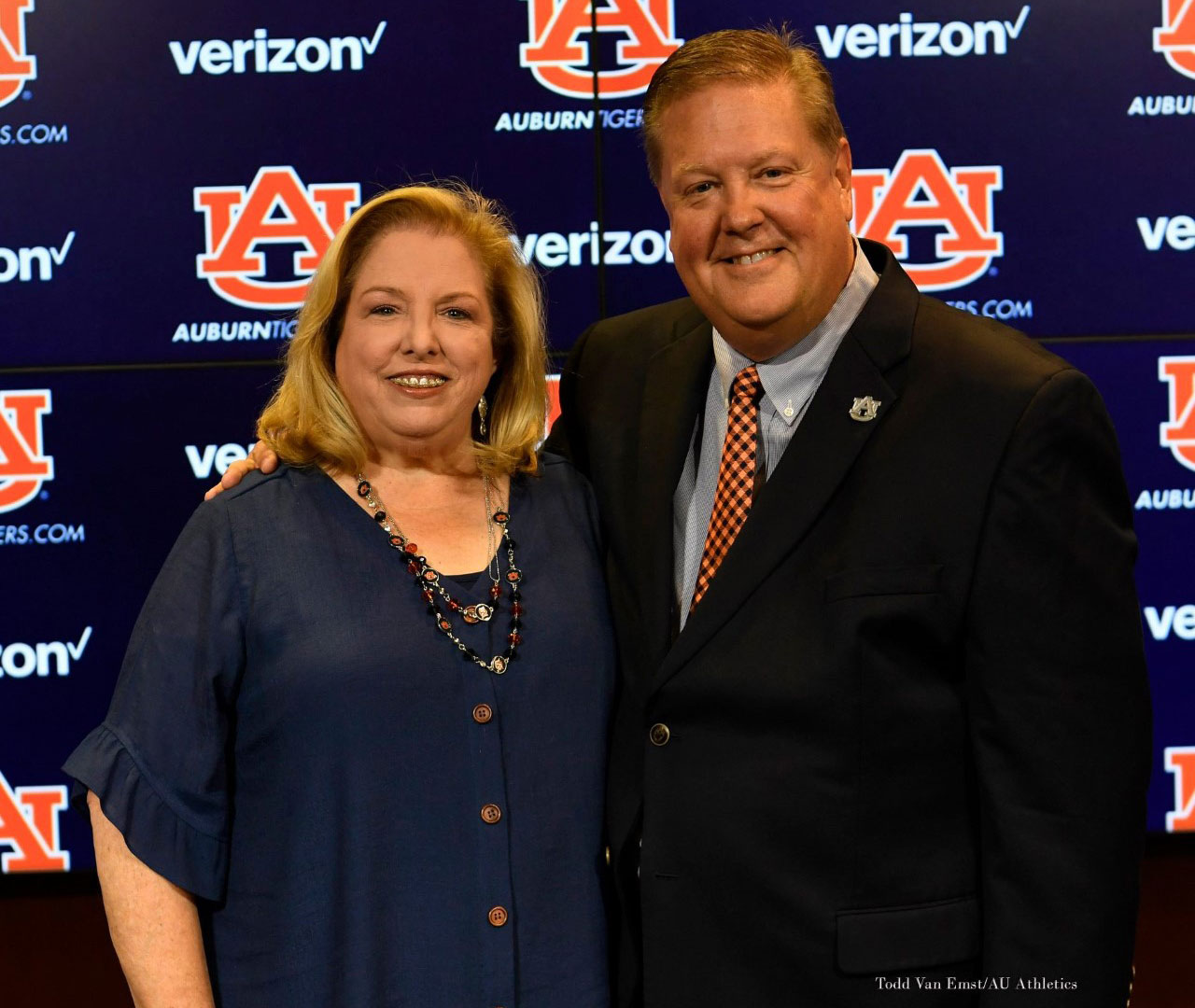 Jan and Andy Burcham in front of an AU background.