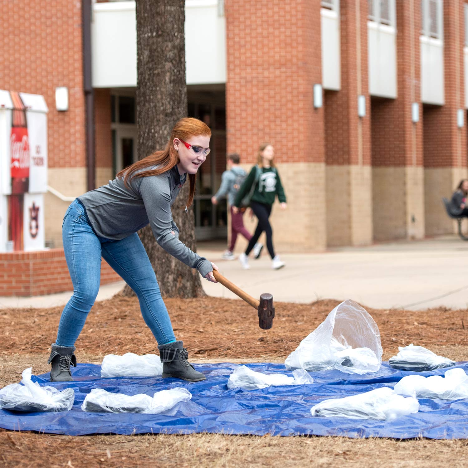 Nutrion/Dietetics senior Alissa Heath smashing a scale.