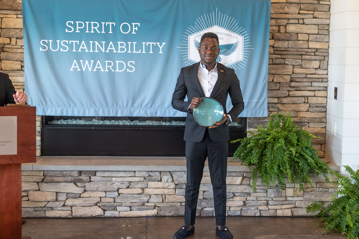 Ifeoluwa Odeniyi accepting Sustainability Award