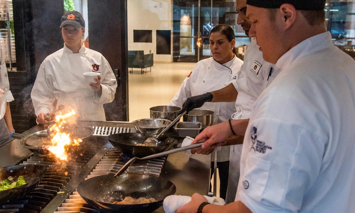 Photo of students in the Rane Culinary Science Center cooking laboratory.