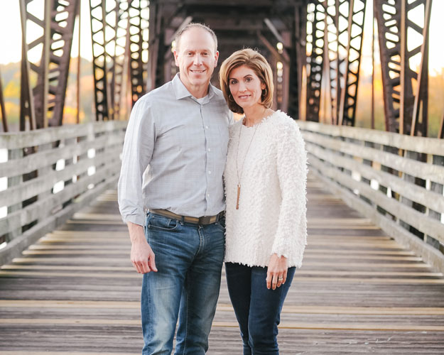Keith and Beth Cox on a bridge