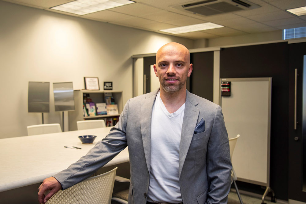 Mark Traynor standing in a gray sport coat.