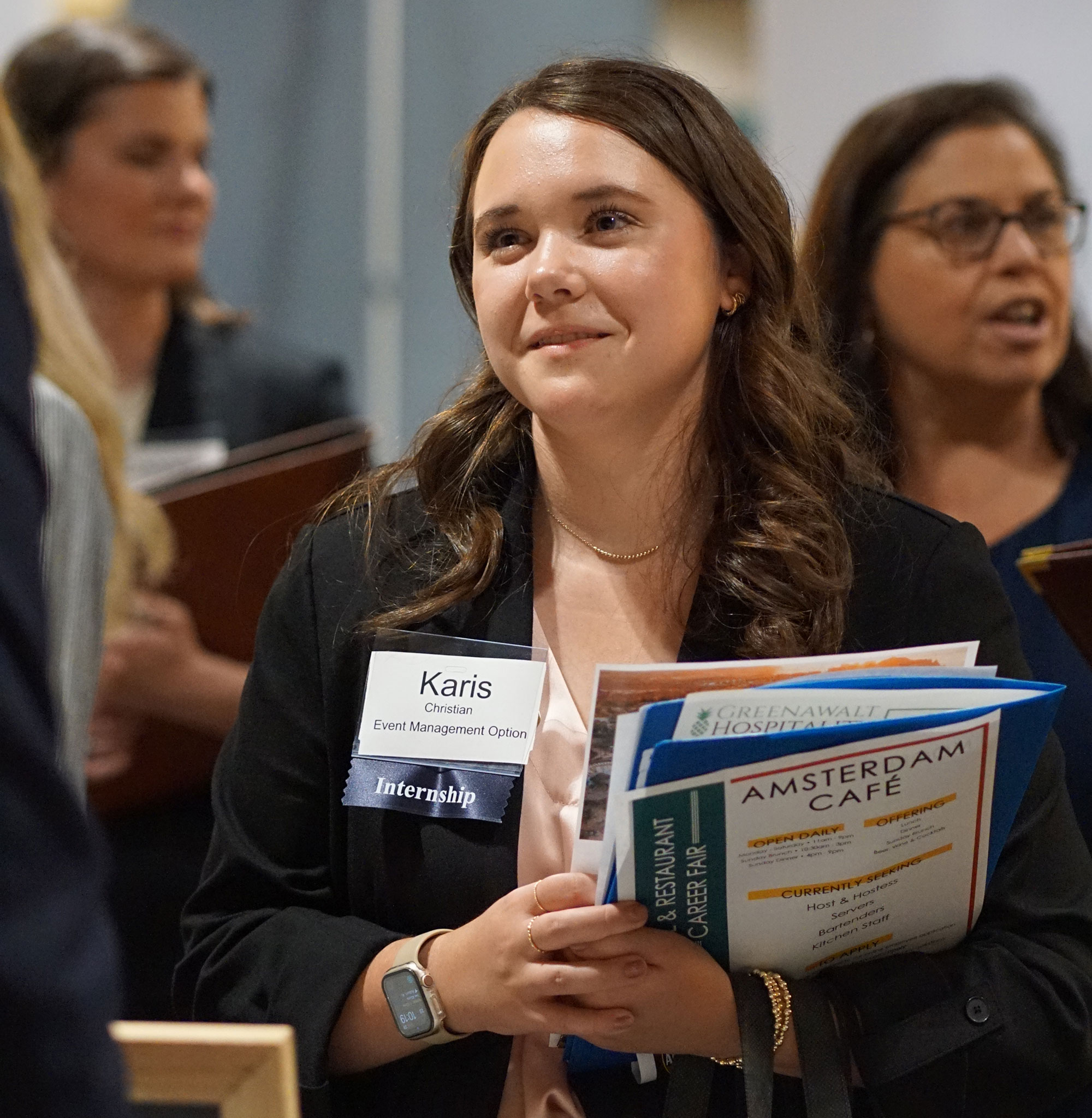 Hospitality student at the visiting a booth at the Career Fair.