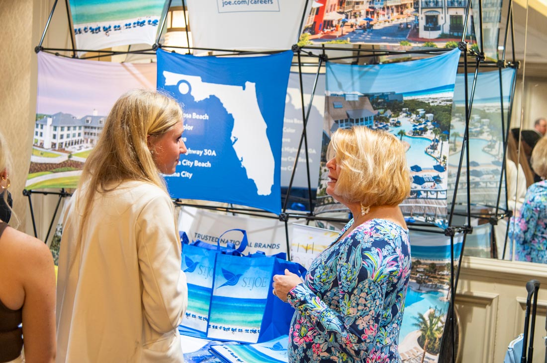 Woman talking with a female student at the career fair.