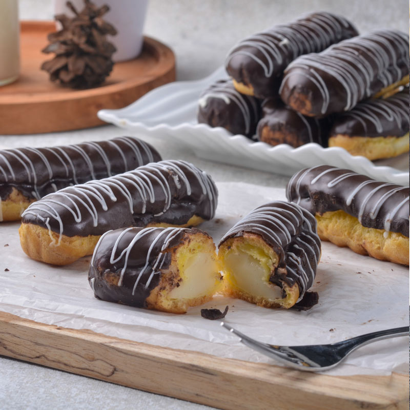 Photo of eclairs on a plate.