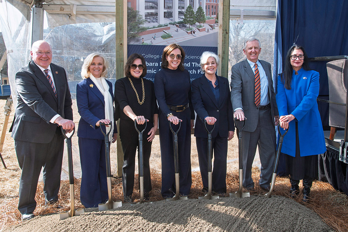 scooping dirt at groundbreaking