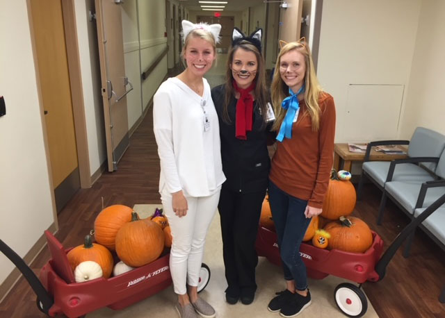 Miranda Julian with two more Child Life students in a hospital.