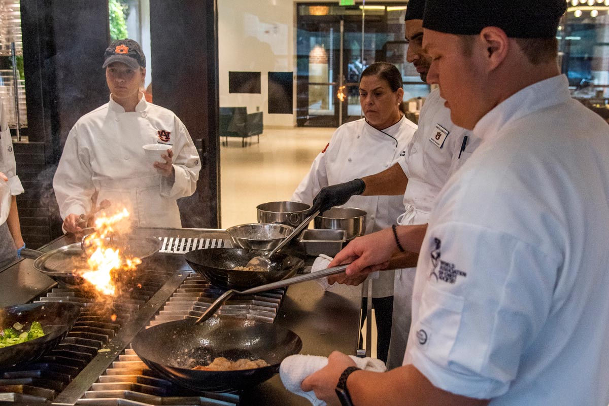 Photo of students in the Rane Culinary Science Center cooking laboratory.